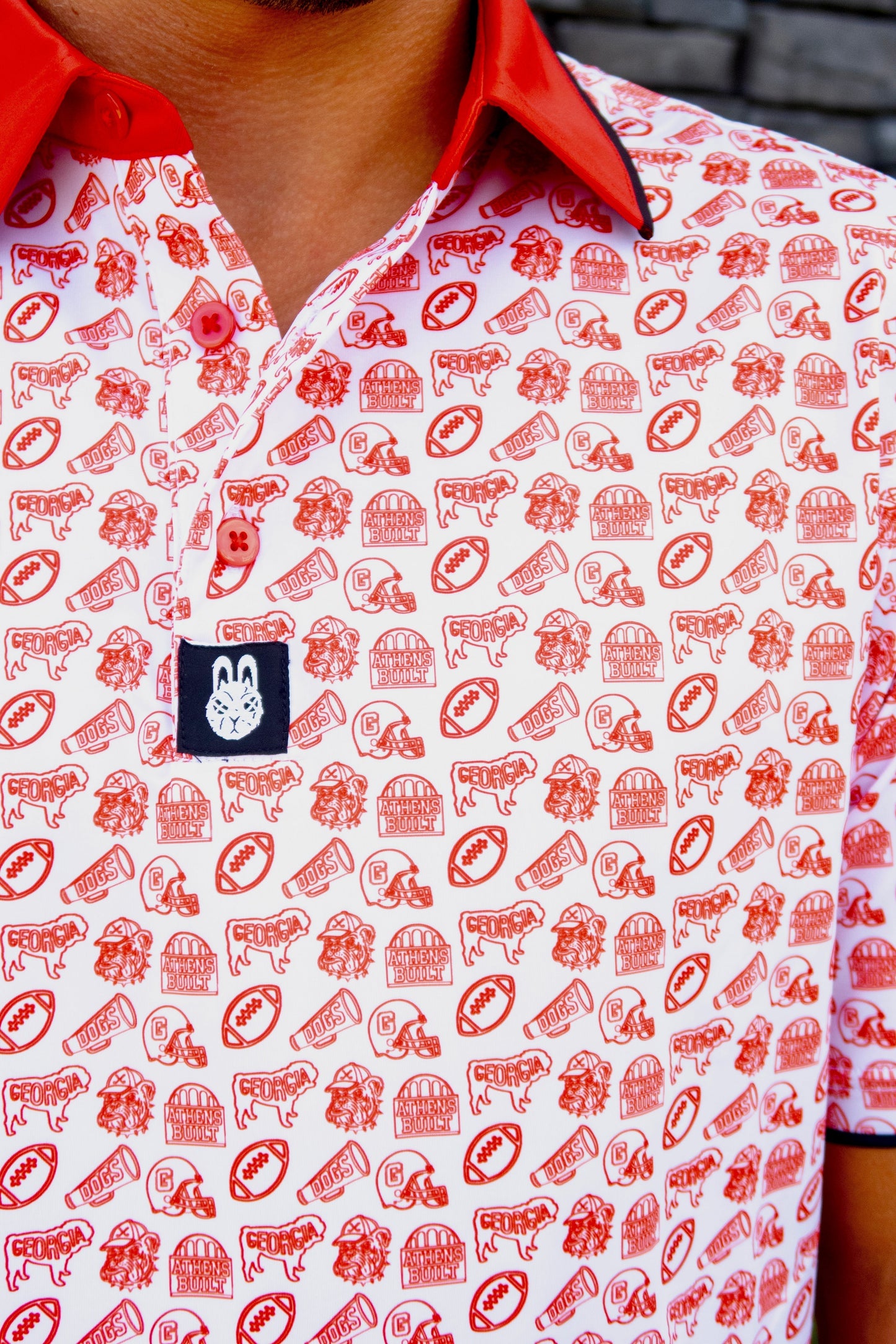 Close-up of the Saturdays in Athens Georgia inspired golf polo by City Golf Collective showing fabric and logo.