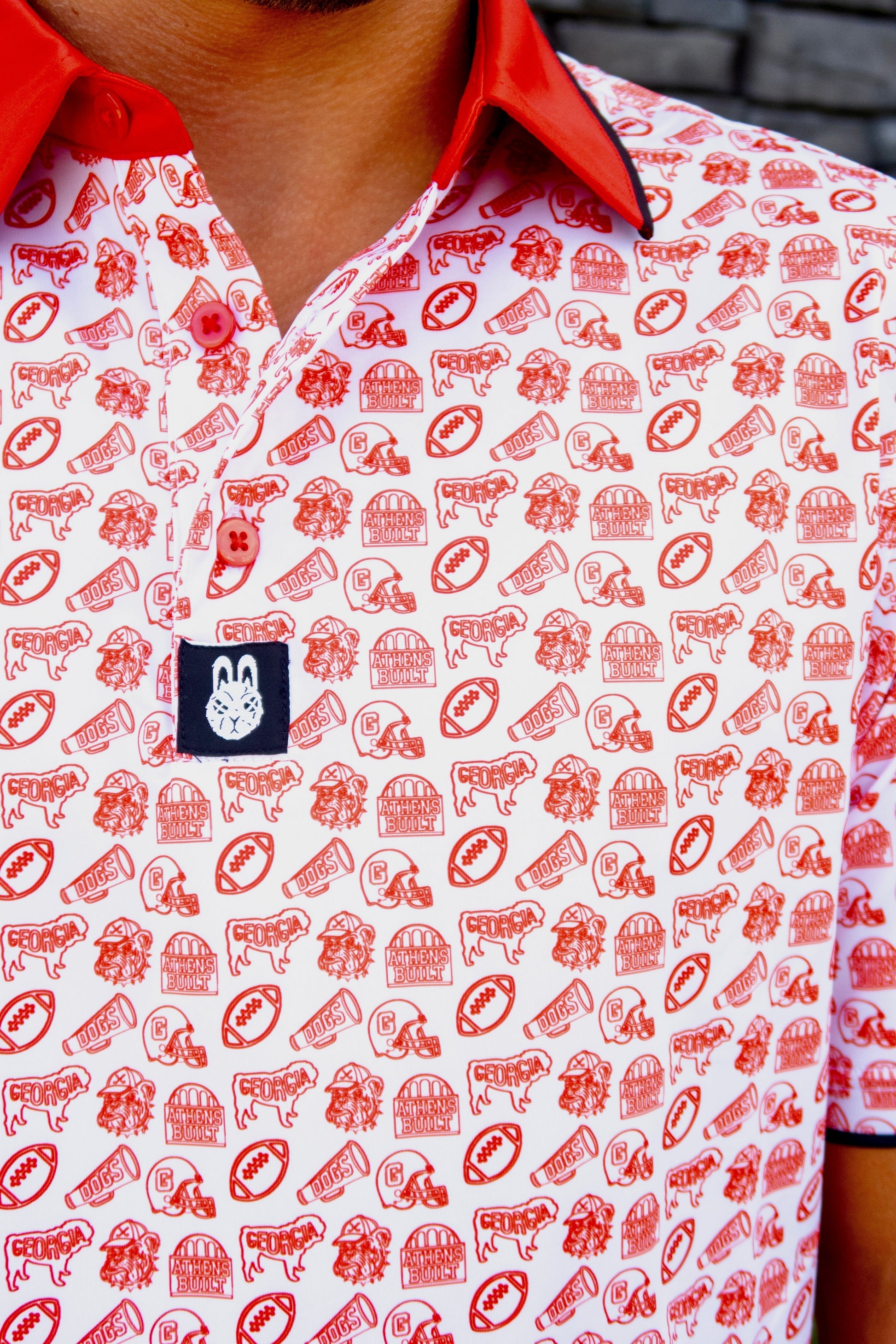 Close-up of the Saturdays in Athens Georgia inspired golf polo by City Golf Collective showing fabric and logo.