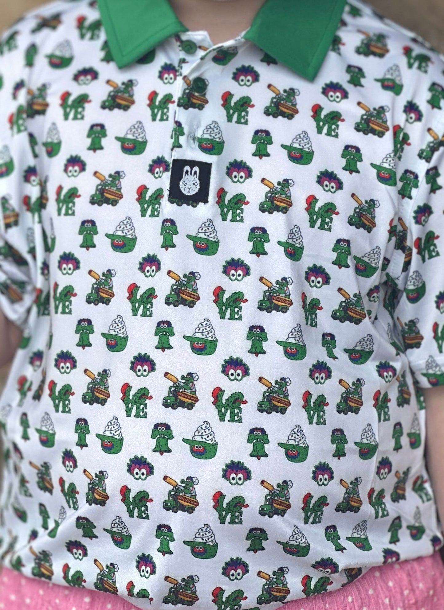 Close-up of The Green Menace Children's Polo showcasing the vibrant Philadelphia-inspired print, premium performance fabric, and detailed design.