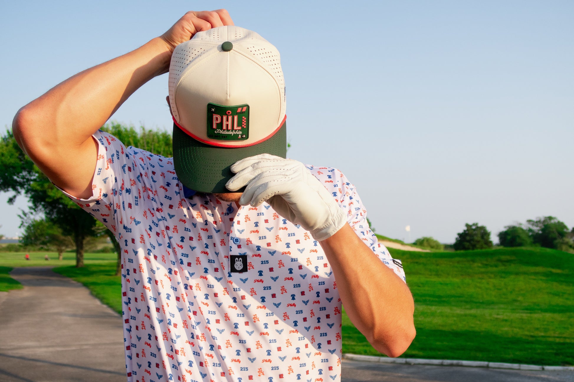 Alternate front angle of The Philly Phrenetic golf polo by City Golf Collective showing collar and chest logo.