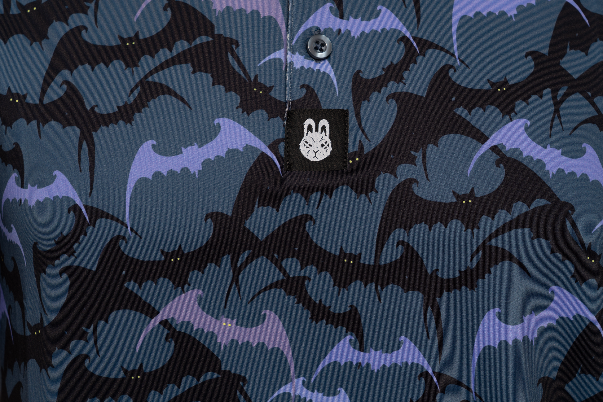 Close-up of Batman golf polo chest detail – subtle design elements with a clean finish, adding edge and character to your golf look.