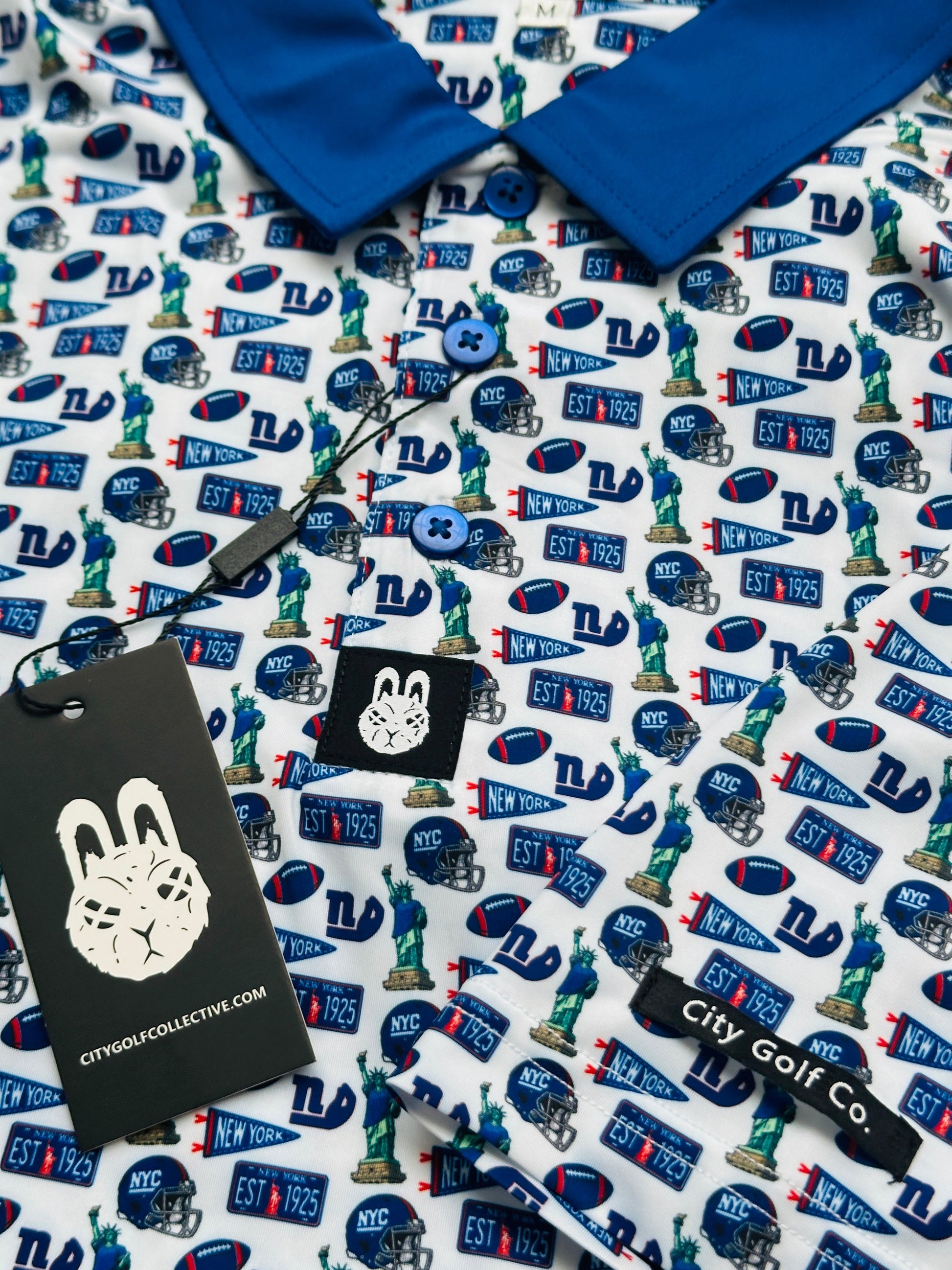 Empire State of Mind New York football golf polo with blue collar and NYC-inspired game day pattern