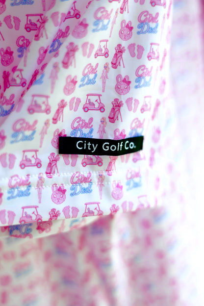 Close-up of The Girl Dad Polo sleeve featuring the colorful Girl Dad print and City Golf Co. woven label.