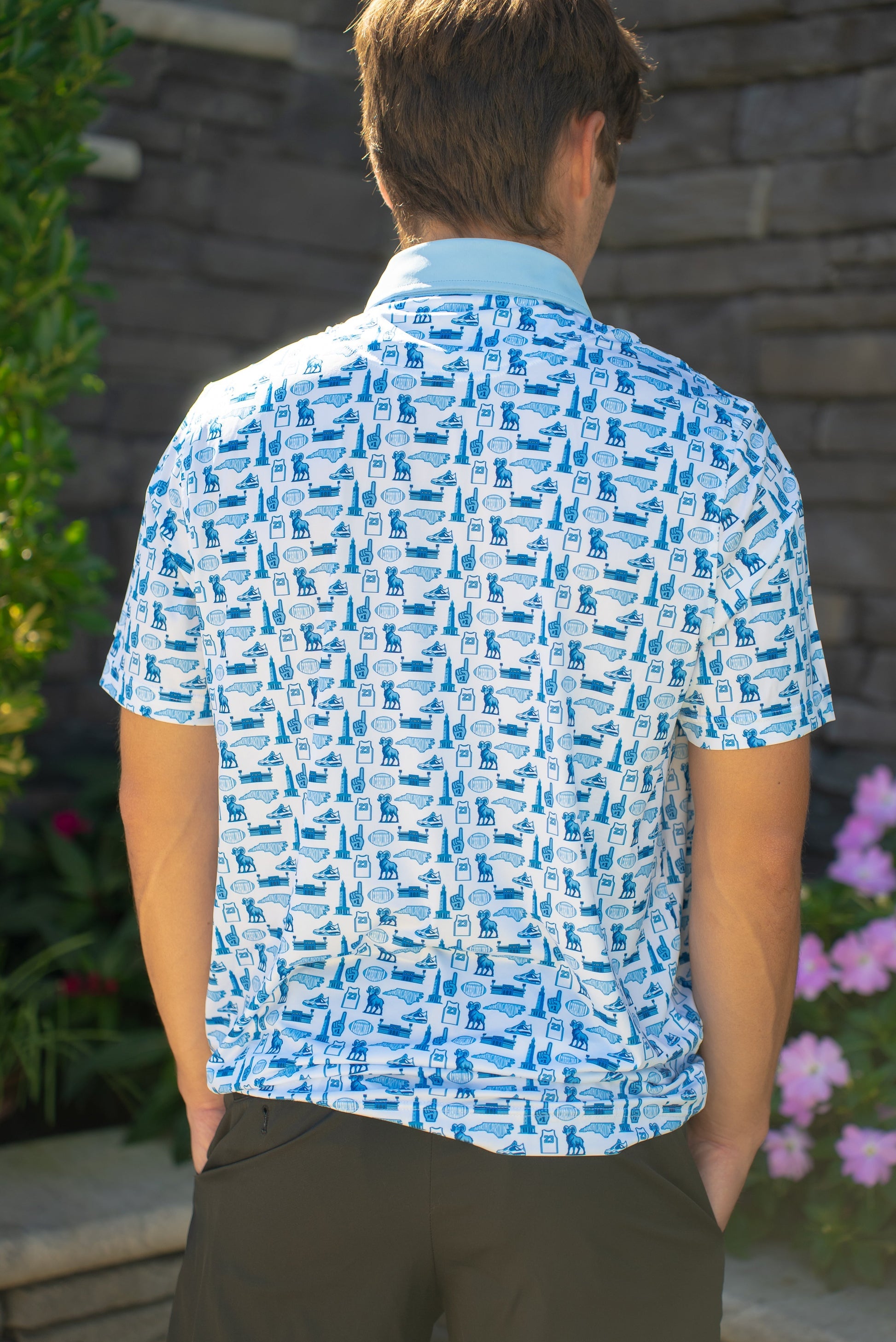 Back view of the Chapel Hill Hangtime UNC-inspired men’s golf polo by City Golf Collective showing full design.