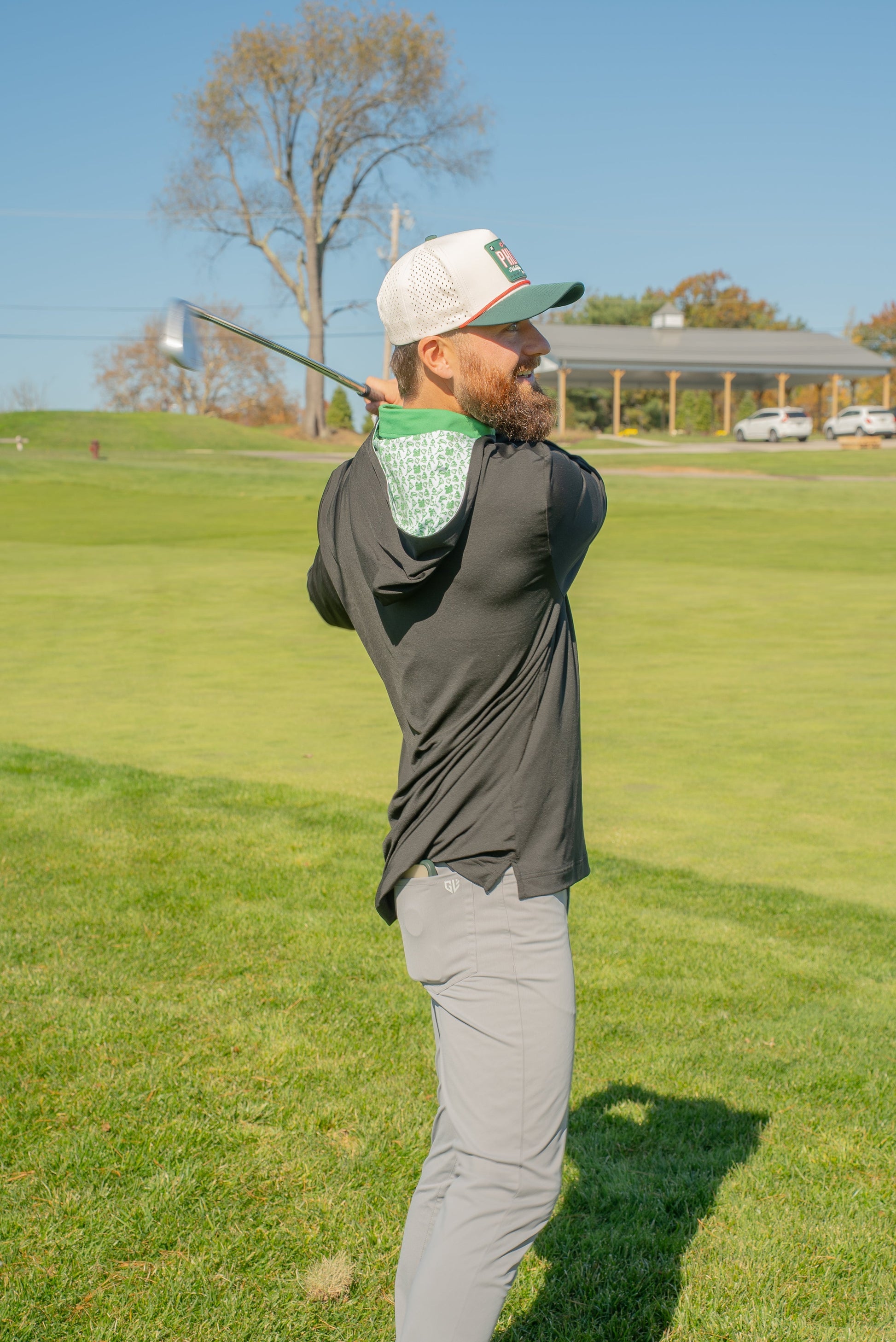 Jake Elliott wearing the Birds & Hoodies golf hoodie by City Golf Collective, showing a clean performance fit.
