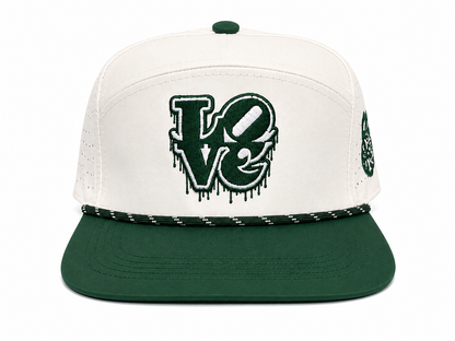 Front view of the Fore the Love of the Game Hat featuring a bold dripping LOVE design embroidered in Philadelphia-inspired green on a premium black rope golf hat.