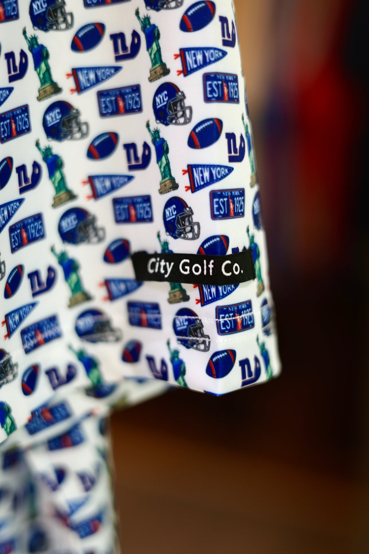 Empire State of Mind New York football polo sleeve with blue, red and NYC-inspired pattern by City Golf Co.