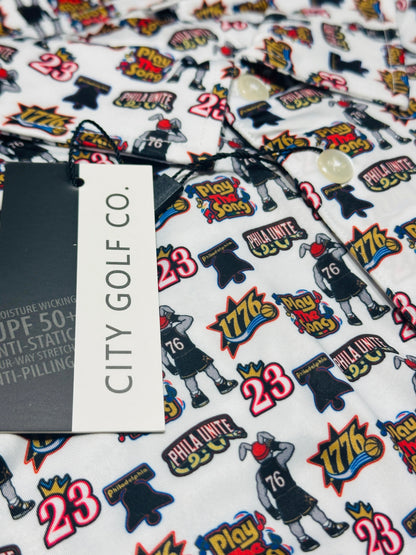 Close-up of Play the Song Polo performance fabric featuring colorful basketball-themed graphics, number 23, 1776 designs and City Golf Co. branding