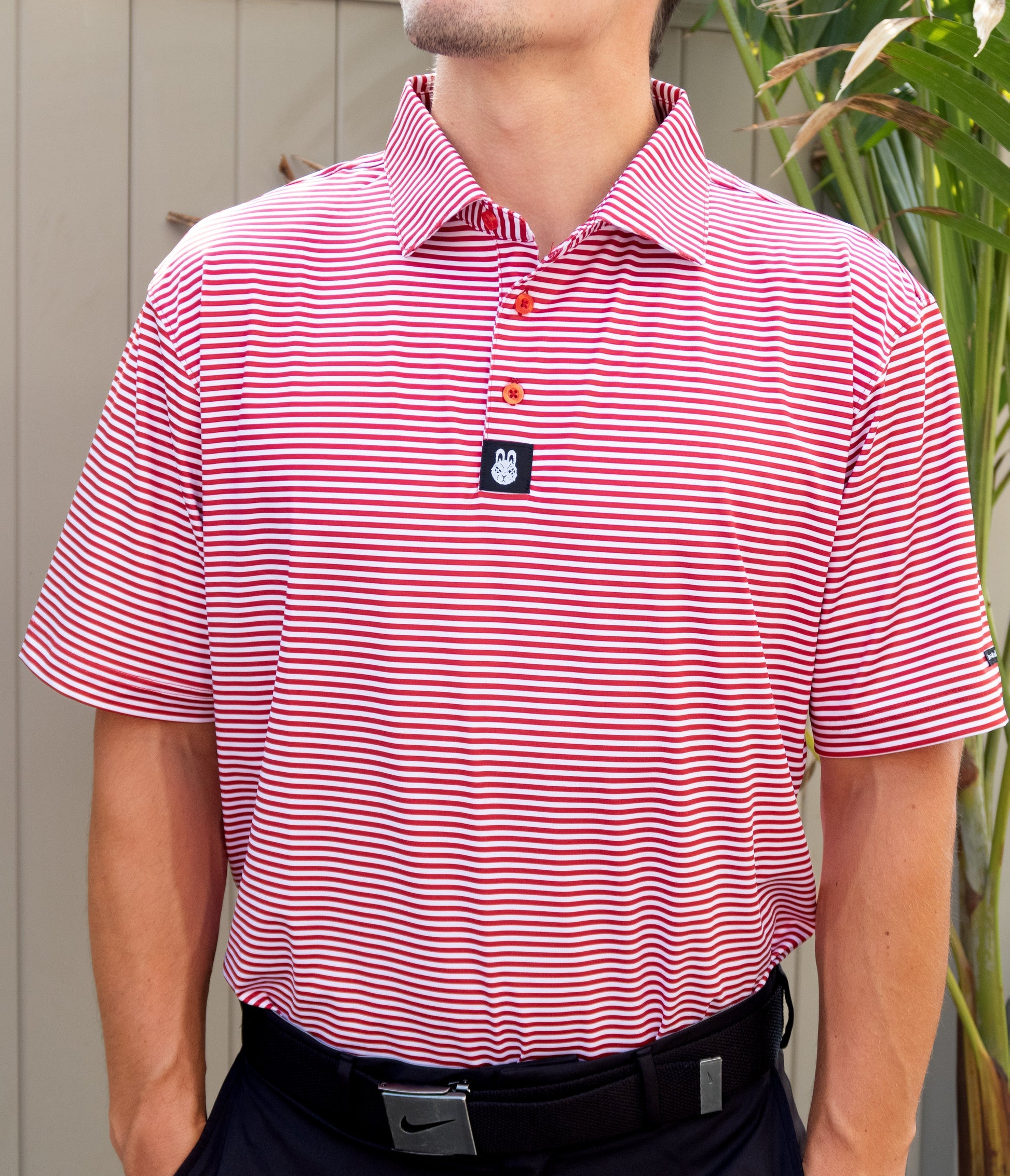 Alternate front view of The Ron Burgundy golf polo by City Golf Collective showing collar and pattern detail.
